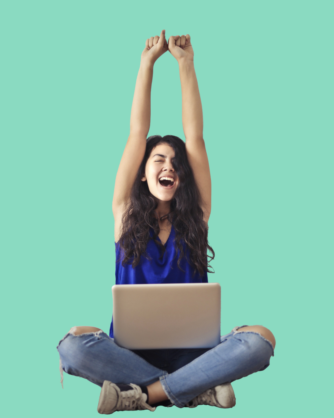 Young woman celebrating on a laptop